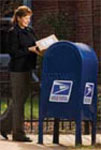 Customer putting mail into collection box