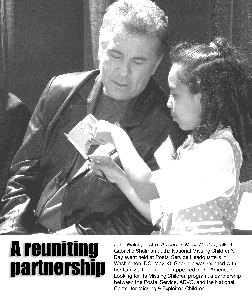 A reuniting partnership. John Walsh, host of America's Most Wanted, talks to Gabrielle Shulman at the National Missing Children's Day event held at Postal Service Headquarters in Washington, DC, May 23, 2002.