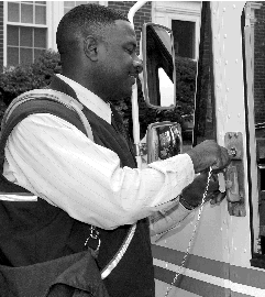 image of a postal worker locking his LLV