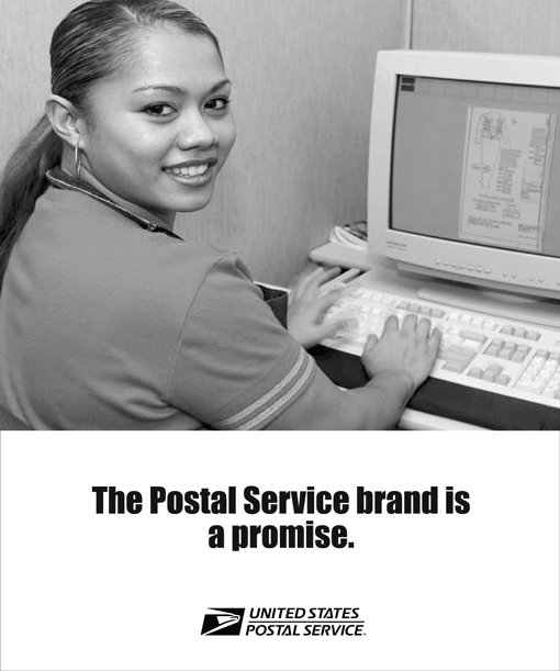 The Postal Service brand is a promise. Image of woman sitting at a computer.
