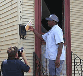 Photographer taking a picture of Letter Carrier Wayne Treaudo