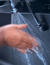 Washing hands under running water.