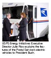 USPS Energy Initiatives Executive Director Julie Rios explains the features of the Postal Service's electric vehicles of President Bush.