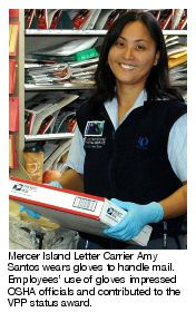 Mercer Island Letter Carrier Amy Santos wears gloves to handle mail. Employees' use of gloves impressed OSHA officials and contributed to the VPP status award.