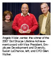 Angelo Wider; center, the winner of the 2007 Dot Sharpe Lifetime Achievement award with Vice President, Employee Development and Diversity, Susan LaChance, left, and CFO Glen Walker.