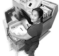 US Postal Service employee sorting mail