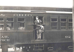 Employee in the door of a railcar